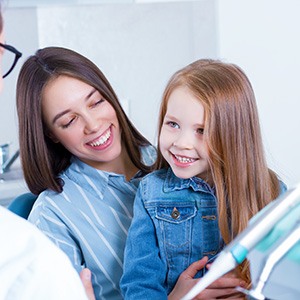 a child smiling during their dental appointment
